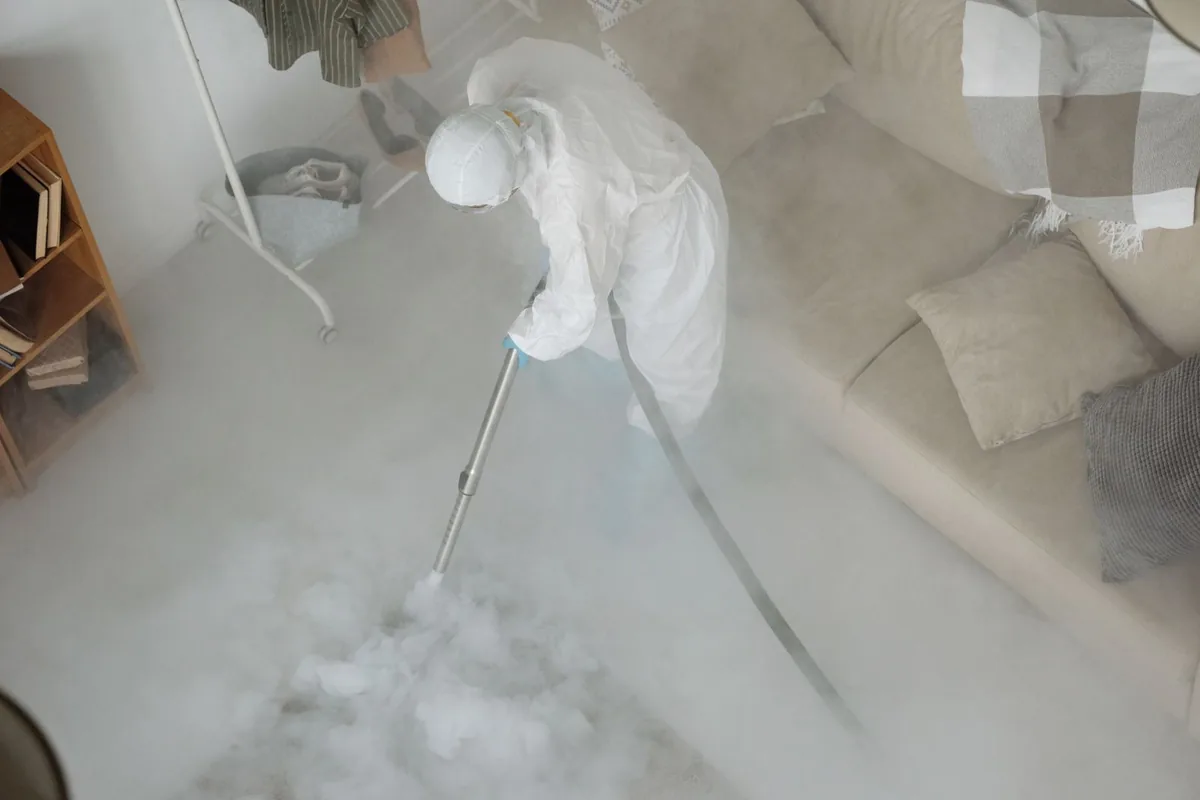Biohazard cleanup technician in protective equipment, Mapleton, ND
